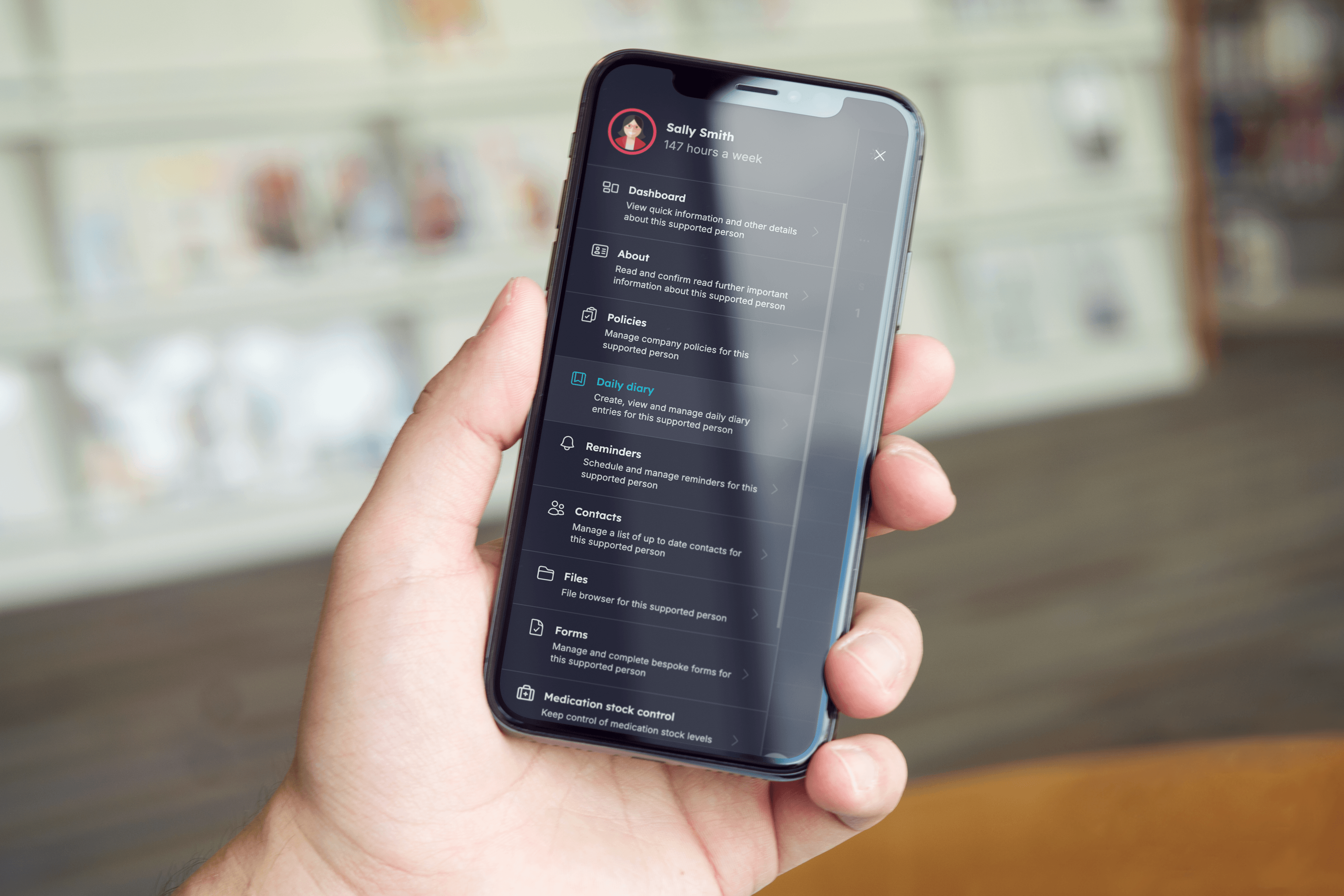 Carerealm mobile app — the main menu showing diary, eMAR, forms, files, policies and the chat inbox